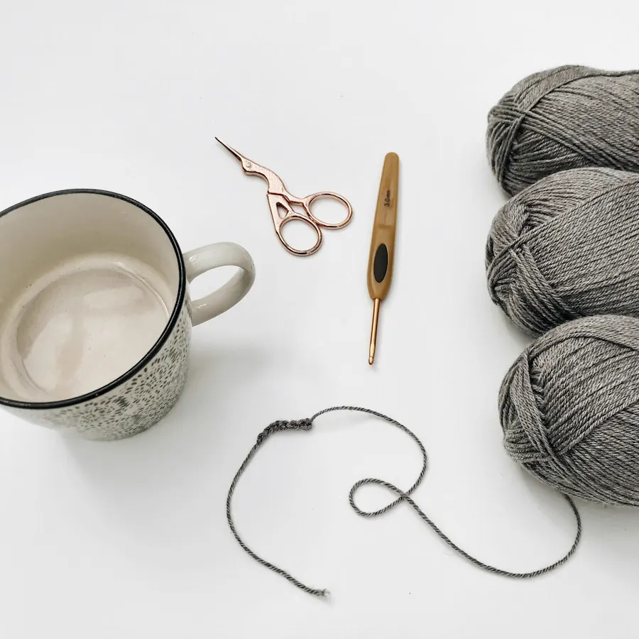 Yarn, scissors and knitting needles